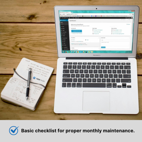 A laptop with the WordPress admin open on top of a work desk. On the sides you can see a cup of coffee and a notebook with notes.
