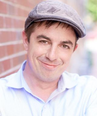 Alex Urevick-Ackelsberg headshot