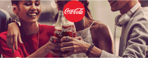 A group toasts with a Coca-Cola