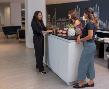 An example from a corporate photography session, which photographs three coworkers in a professional office space.