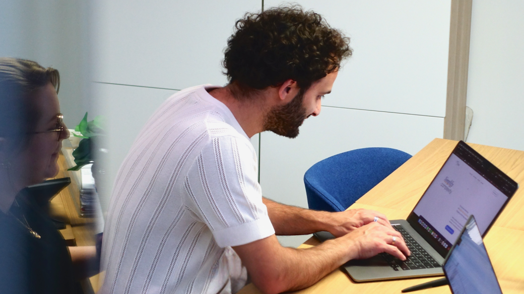 An employee working on a laptop