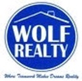WOLF REALTY INC. Logo